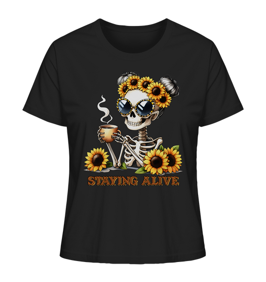Shirt in schwarz mit Skeleton Girl, Sonnenblumenkranz, Sonnenbrille, Kaffeetasse und dem Spruch „Staying Alive“