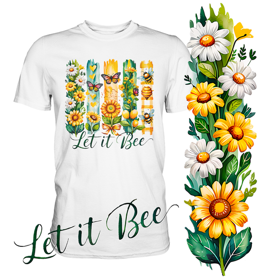 Weißes T-Shirt mit gelben Blumen, mehreren Bienen und dem Schriftzug „Let it bee“. Rechts im Bild gelbe und weiße Blumen.